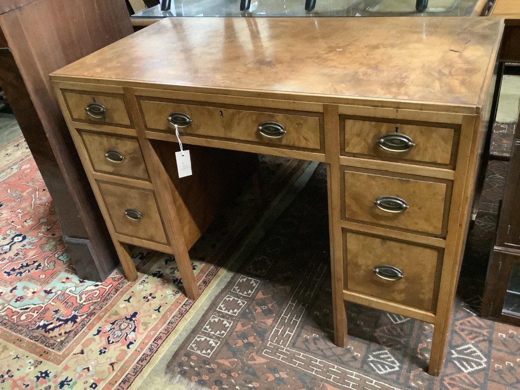 A mid 20th century Heals walnut kneehole desk, width 106cm depth 55cm height 78cm